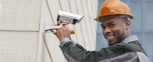African man installing a CCTV camera